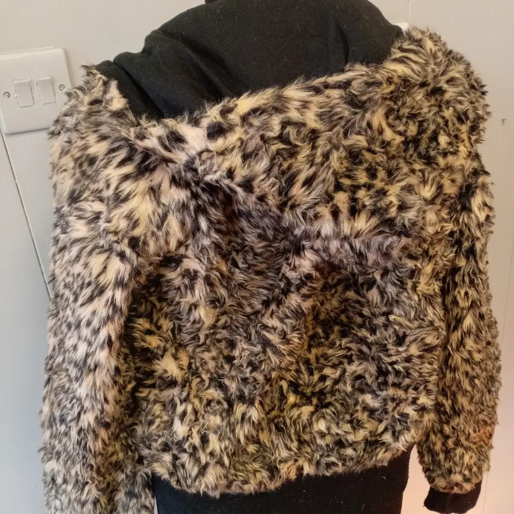 black and tan faux fur zip-up jacket with hood pockets pom-poms 3.webp